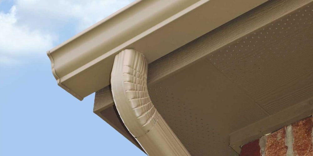 Close-up of seamless gutter installation on a residential home. Roof Dudes Midwest provides expert gutter installation and repair services, ensuring efficient water drainage and protection for your home’s exterior.