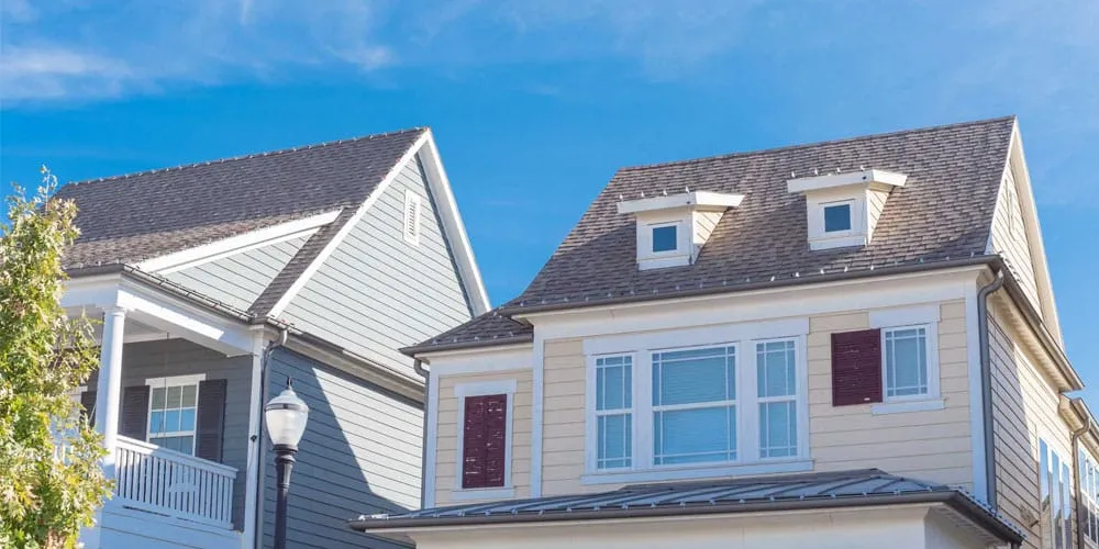 Residential home with recently installed asphalt shingle roof by Roof Dudes Midwest. Specializing in residential roofing, roof replacement, and repairs, ensuring long-lasting protection and curb appeal.